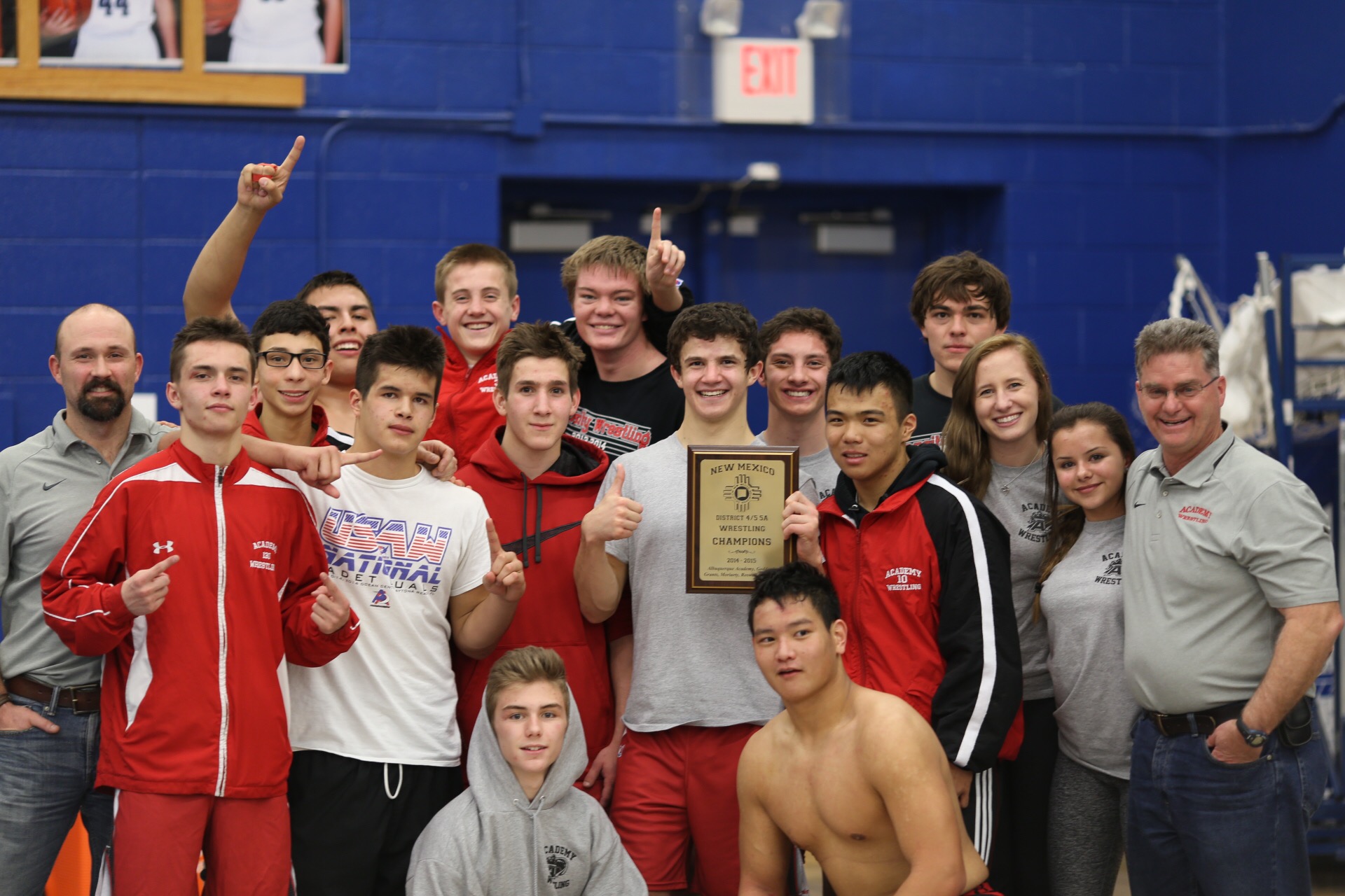 Varsity wrestling takes first in district meet