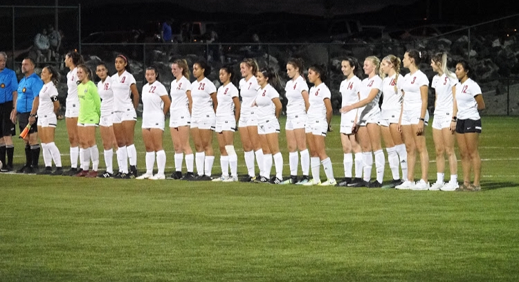 Chargers line up for the National Anthem