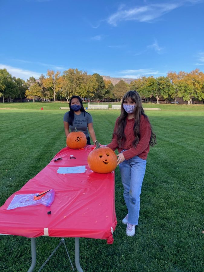 Seniors Lily Johnson and Maddie Tanner-Creecy at the pumpkin carving event last weekend.