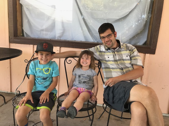 David Gray 98 (right), with his two kids, Felix, age 8 (left), and Willa, age 3 (middle).