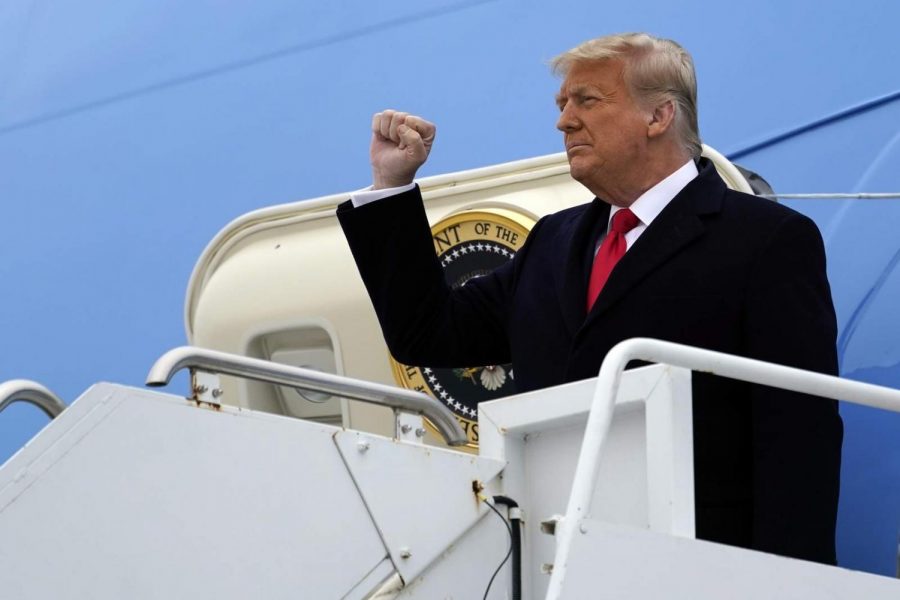 President Donald Trump gestures as he steps off Air Force One upon arrival at Valley International Airport, Tuesday, Jan. 12, 2021, in Harlingen, Texas. (AP Photo/Alex Brandon) (Copyright 2021 The Associated Press. All rights reserved.)