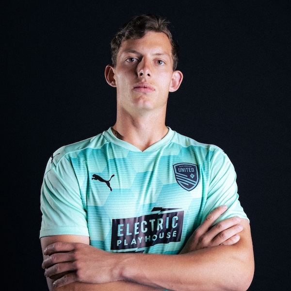 Alex Touche 17 sporting new electric turquoise United jersey.