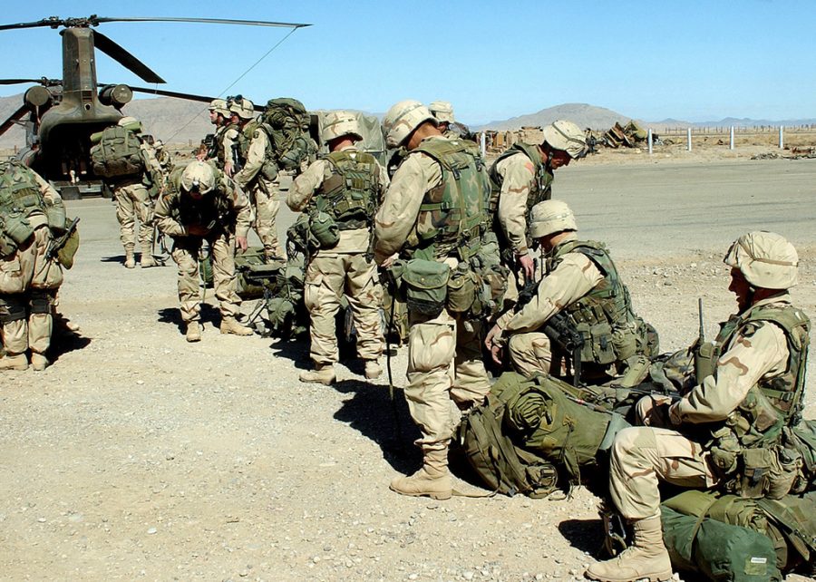 Soldiers from the 101st Airborne Division (Air Assault), 3rd Brigade, Fort Campbell, Kentucky, prepare to enter a CH-47 Chinook helicopter.  