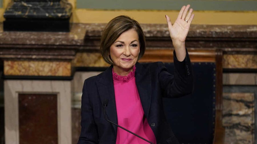 Iowa Gov. Kim Reynolds waves after delivering her Condition of the State address before a joint session of the Iowa Legislature, Tuesday, Jan. 11, 2022, at the Statehouse in Des Moines, Iowa. (AP Photo/Charlie Neibergall)