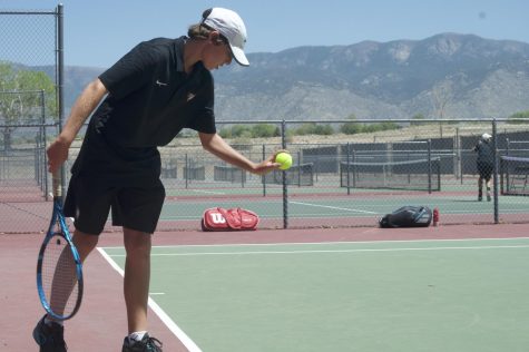 Jacob Anderson '25 setting up to serve