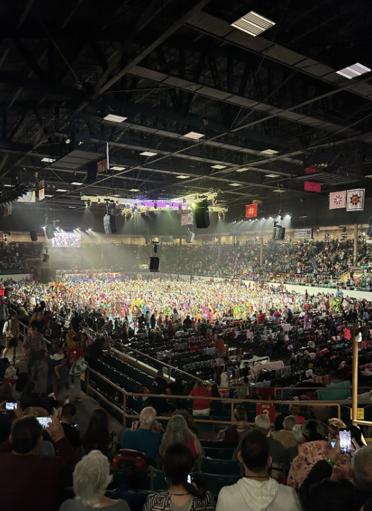 Tingley+Coliseum+floor+is+packed+with+colorful+dancers.