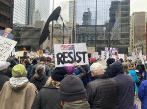 Thousands march at Daley Plaza, in Chicago. 