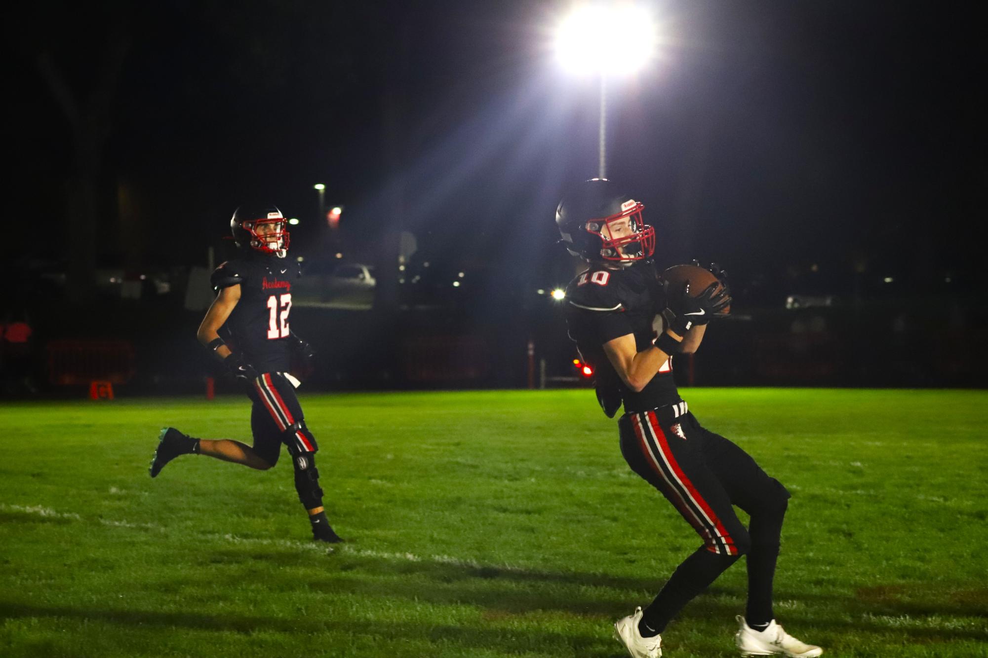 Chargers and Cheer Team Draw Crowds Under the Lights